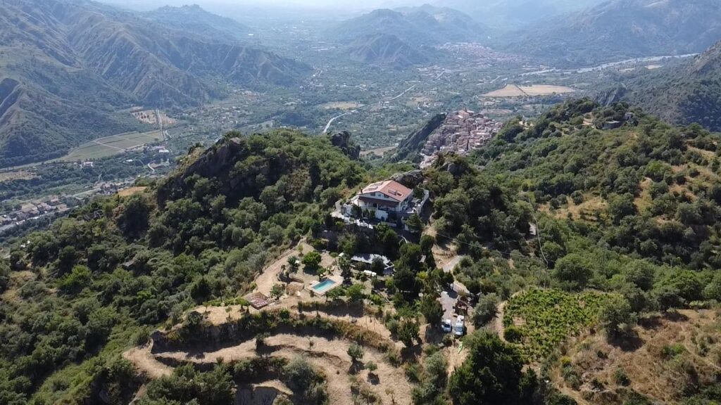 Drone image of Vista Alcantara on a mountain top in Sicily.