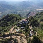 Drone image of Vista Alcantara on a mountain top in Sicily.
